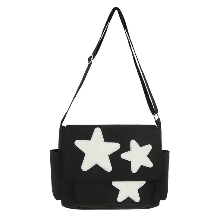 Borsa a tracolla nera con stelle bianche, design moderno, tasche laterali, ideale per moda casual e shopping. Accessorio trendy per ogni occasione.