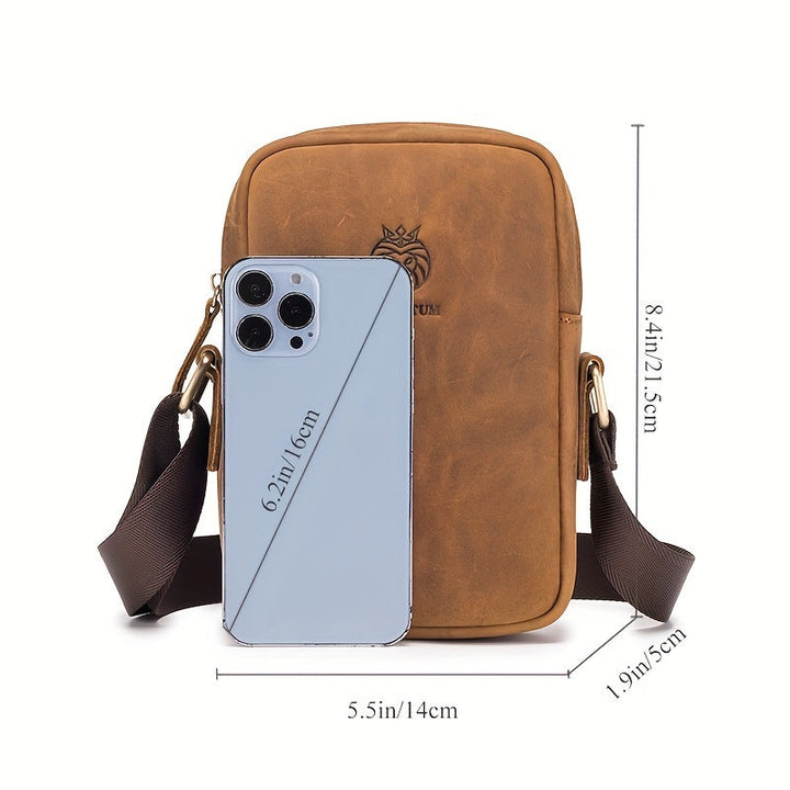 Borsa a tracolla in pelle marrone con smartphone grigio, dimensioni 14x21,5x5 cm. Design elegante, ideale per accessori moda e tecnologia.