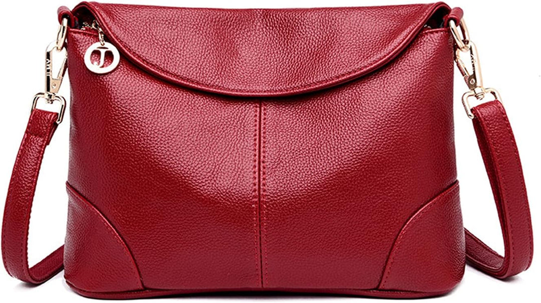 Borsa a tracolla in pelle rossa, elegante e moderna, con chiusura a zip e dettagli in metallo dorato. Accessorio moda donna, stile casual chic.