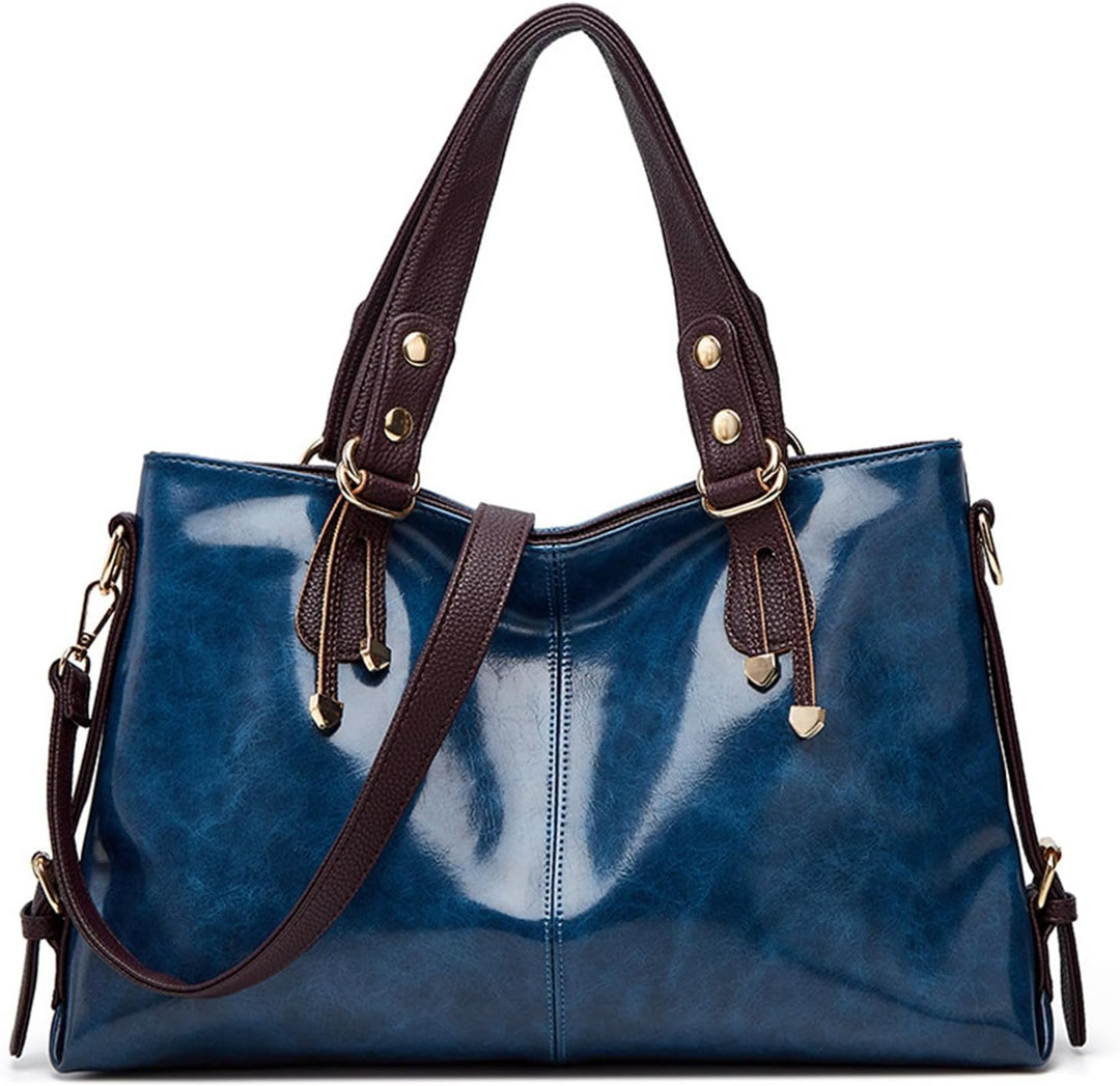 Borsa a mano in pelle blu lucida con manici marroni, dettagli in metallo dorato, design elegante e spazioso, perfetta per moda femminile.