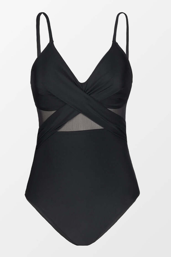 Costume intero nero con spalline sottili, design incrociato e inserti in rete trasparente. Elegante e moderno, perfetto per la spiaggia o la piscina.