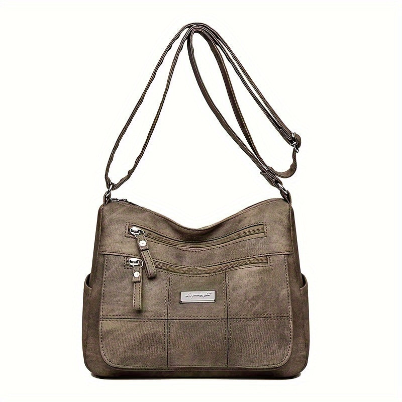 Borsa a tracolla in pelle marrone con tasche multiple e cerniere, design elegante e pratico, ideale per donna, moda accessori, shopping.