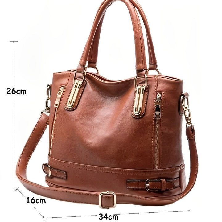 Borsa a mano in pelle marrone con tracolla regolabile, dettagli in metallo dorato, dimensioni 34x16x26 cm, elegante e spaziosa per ogni occasione.