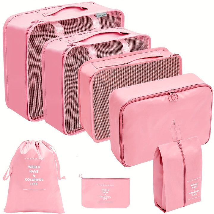 Set di organizer da viaggio rosa, 8 pezzi, con borse a rete e sacchetti per valigia. Ideale per organizzare vestiti e accessori in viaggio.