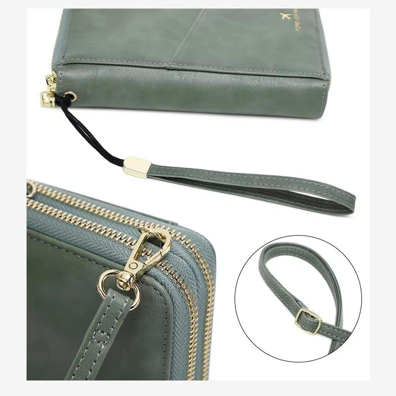 Portafoglio donna in pelle verde con cerniera dorata, cinturino da polso regolabile, design elegante e moderno, accessorio moda femminile.