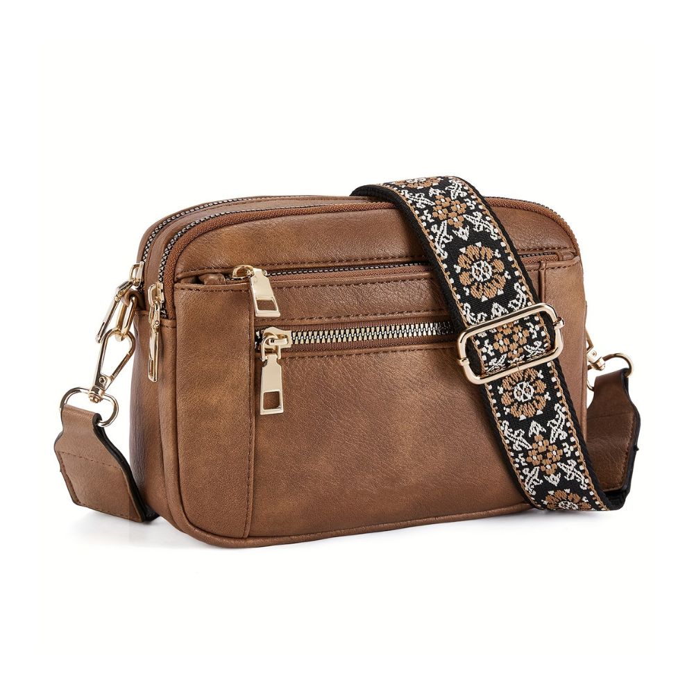 Borsa a tracolla in pelle marrone con cerniere dorate e cinturino ricamato floreale. Elegante accessorio moda donna, perfetto per ogni occasione.