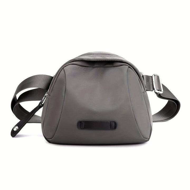 Borsa a tracolla grigia in pelle, design moderno, chiusura con zip, cinturino regolabile, ideale per donna, accessorio moda elegante e pratico.