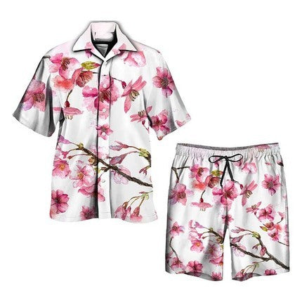 Completo pigiama estivo da uomo con stampa floreale di ciliegio, camicia a maniche corte e pantaloncini, tessuto leggero e traspirante.