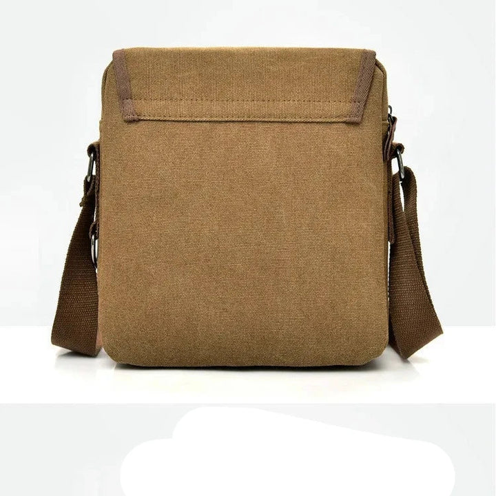 Borsa a tracolla in tela marrone, design minimalista, chiusura superiore, ideale per uomo e donna, perfetta per uso quotidiano e viaggi.