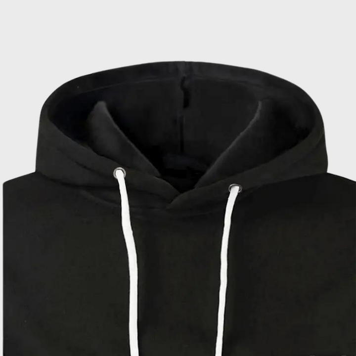 Felpa con cappuccio nera unisex, cordini bianchi, tessuto morbido, ideale per abbigliamento casual e sportivo. Disponibile in varie taglie.