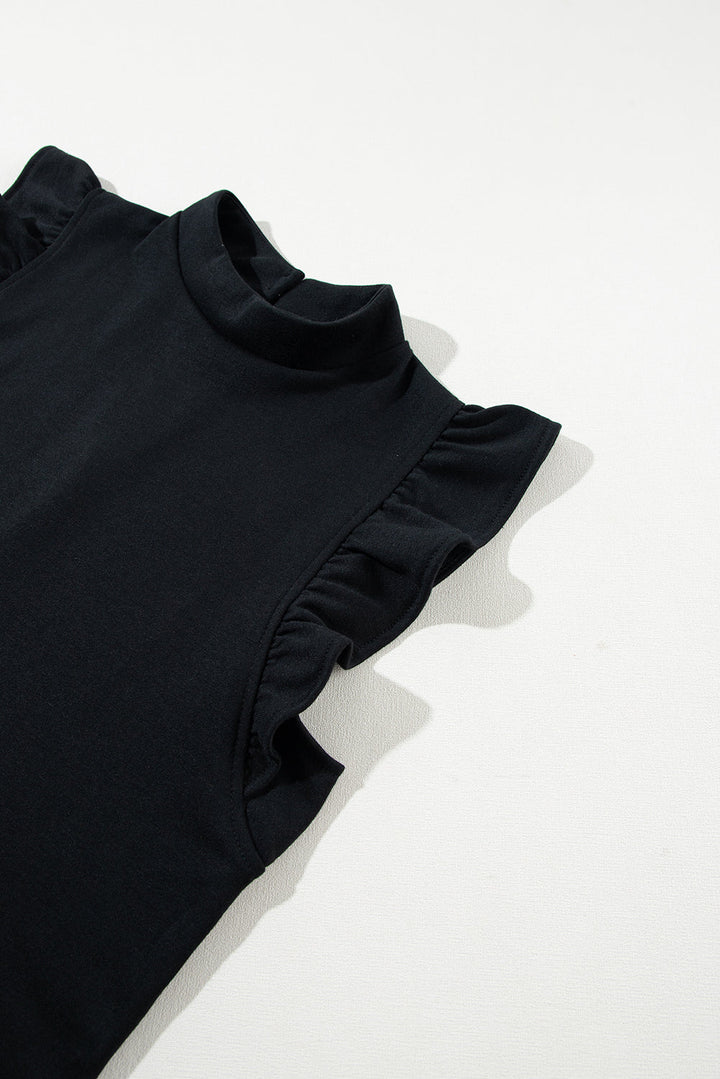 Maglia nera senza maniche con volant, collo alto, tessuto morbido. Elegante e versatile, ideale per look casual o formali.