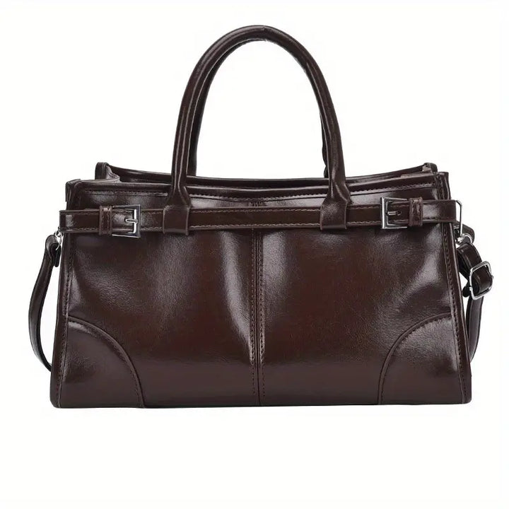 Borsa a mano in pelle marrone scuro, design elegante con doppio manico e tracolla regolabile, ideale per moda donna e accessori di lusso.