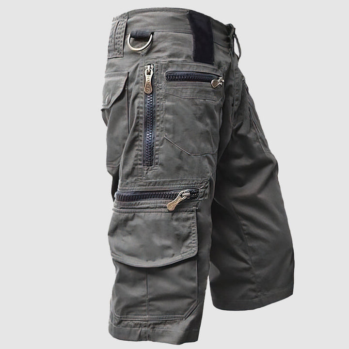 Pantaloncini cargo uomo grigi, multi-tasche con zip, design casual e resistente, ideale per attività all'aperto e tempo libero.