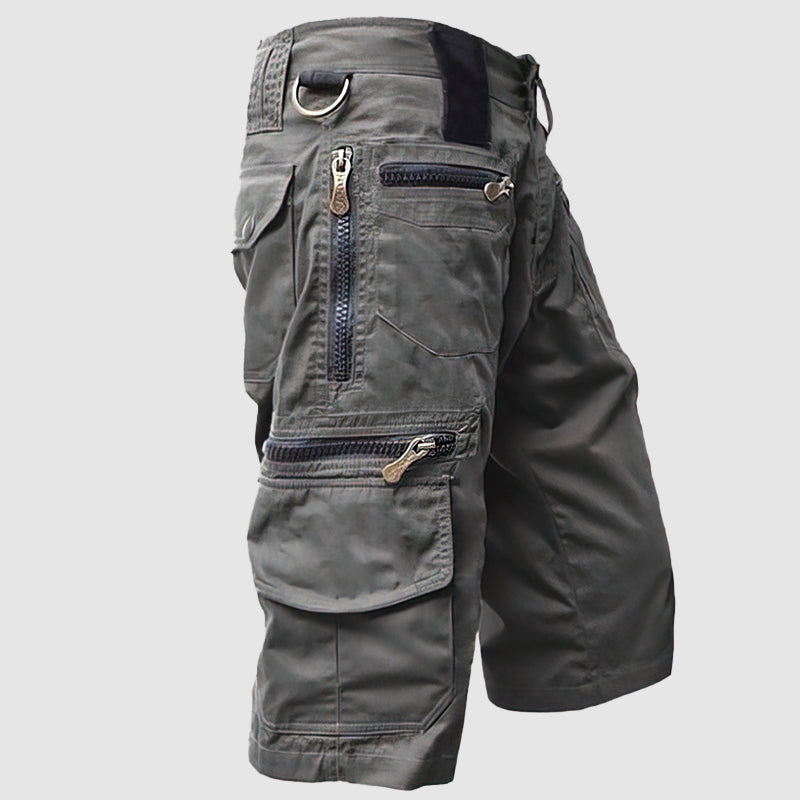 Pantaloncini cargo uomo grigi, multi-tasche con zip, design casual e resistente, ideali per attività all'aperto e tempo libero.