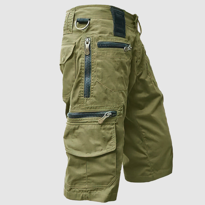 Pantaloncini cargo verdi da uomo, multi-tasche con zip, stile militare, tessuto resistente, ideali per outdoor e attività sportive.