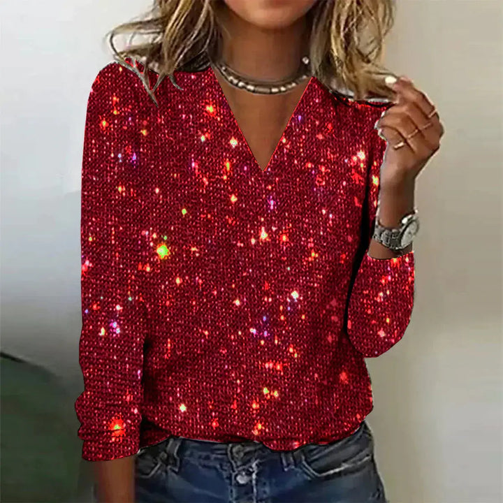 Maglia donna rossa con paillettes scintillanti, scollo a V, maniche lunghe, ideale per feste e serate eleganti. Moda femminile glamour.