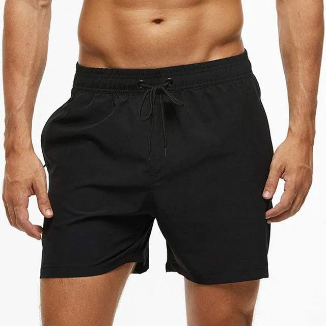 Pantaloncini da uomo neri, elastico in vita, cordoncino regolabile, ideale per sport e tempo libero. Design moderno e confortevole.