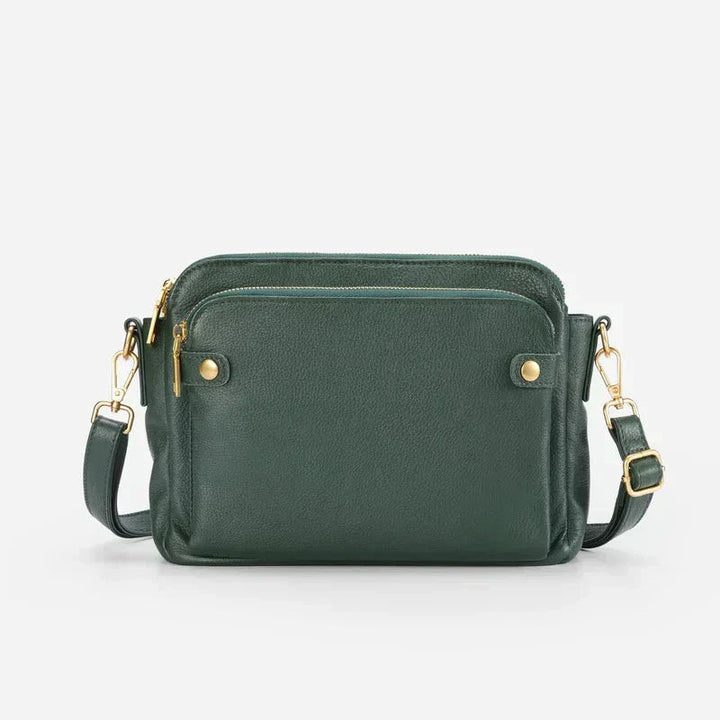 Borsa a tracolla verde scuro in pelle, con cerniere dorate e tasche multiple. Design elegante e funzionale, ideale per moda donna.