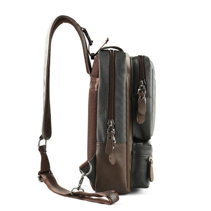 Zaino a tracolla in pelle marrone e nera, design compatto con doppie cerniere, ideale per uomo, moda casual, accessorio versatile e resistente.