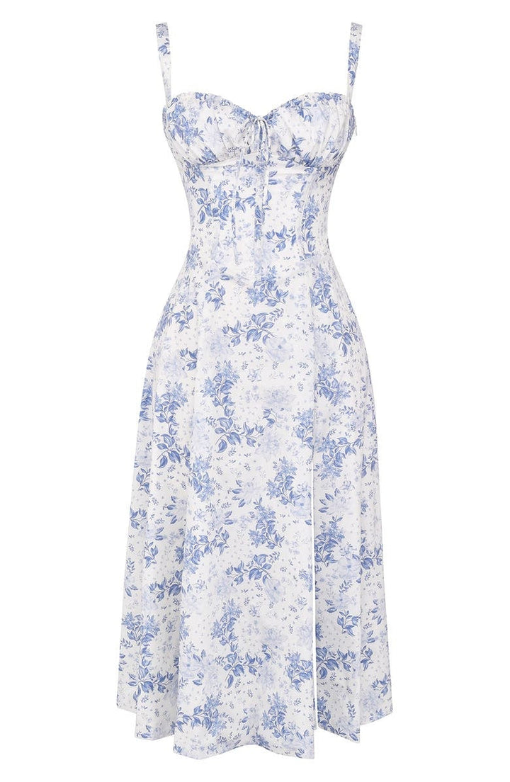 Abito estivo donna a fiori blu e bianchi, stile vintage, con spalline sottili e scollo a cuore. Perfetto per occasioni casual e eleganti.