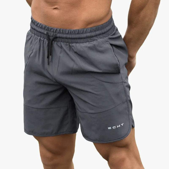Shorts sportivi grigi da uomo, marchio ECHT, con elastico in vita e coulisse. Ideali per allenamento e fitness. Tessuto leggero e traspirante.