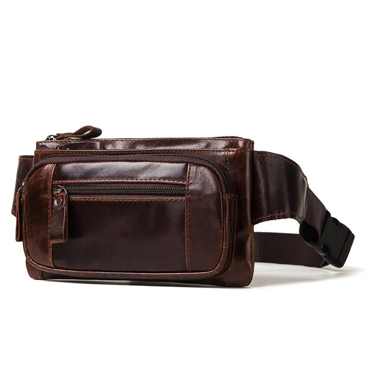 Marsupio in pelle marrone scuro con cerniere multiple, design elegante e pratico, ideale per viaggi e uso quotidiano. Accessorio moda uomo e donna.