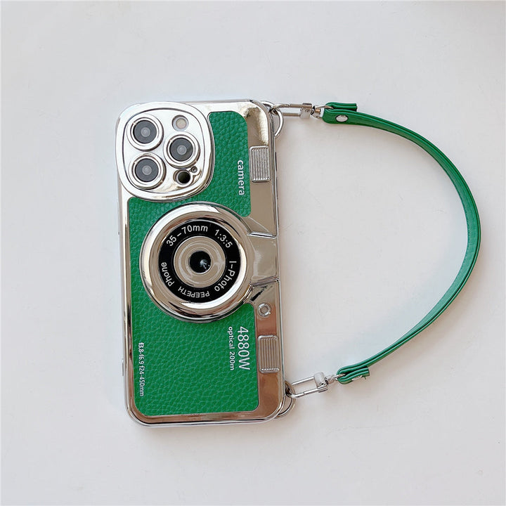 Custodia per iPhone a forma di fotocamera vintage verde, design retrò, obiettivo decorativo, cinturino verde, compatibile con modelli recenti.