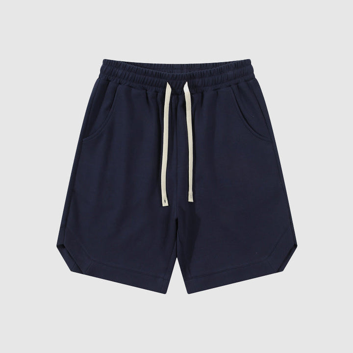 Pantaloncini sportivi blu scuro da uomo, con tasche laterali e coulisse in vita. Ideali per attività sportive e tempo libero.