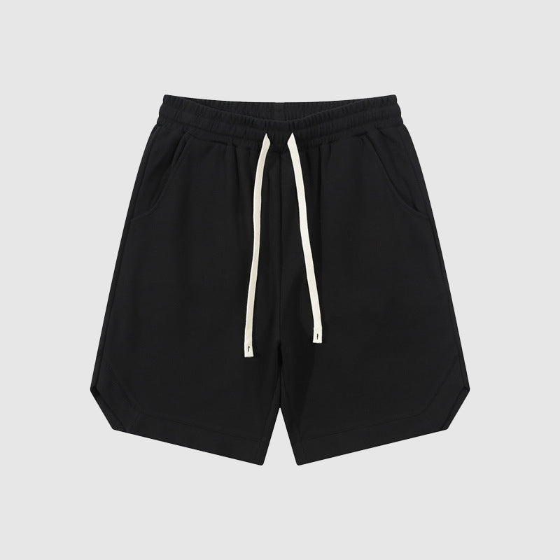 Pantaloncini neri da uomo in cotone, con coulisse bianca, tasche laterali, design casual. Ideali per sport e tempo libero.