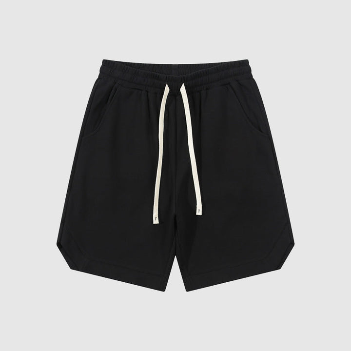 Pantaloncini neri da uomo in cotone, con coulisse bianca, tasche laterali, design casual. Ideali per sport e tempo libero.
