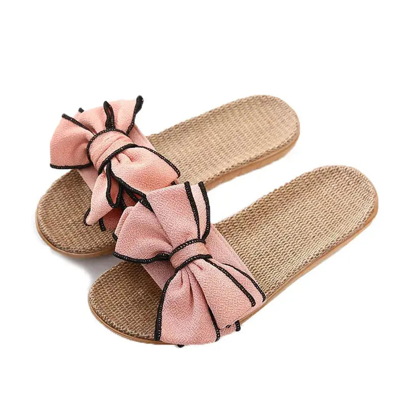 Sandali estivi da donna con fiocco rosa, suola in paglia intrecciata, design casual elegante, perfetti per la moda estiva e il comfort quotidiano.
