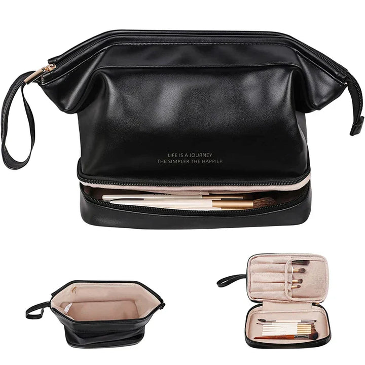 Elegante borsa da trucco nera in pelle sintetica con scomparti multipli, cerniera dorata e manico laterale. Ideale per organizzare cosmetici e accessori.