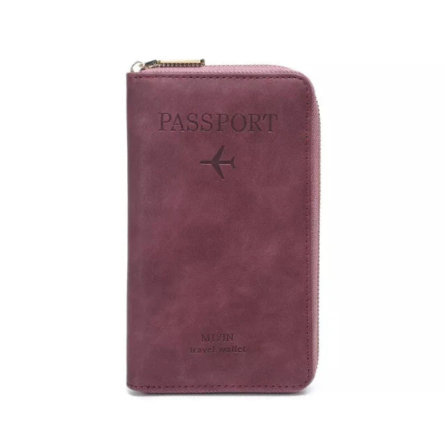 Portafoglio da viaggio in pelle rosa per passaporto, con cerniera e icona aereo, ideale per organizzare documenti e carte durante i viaggi.