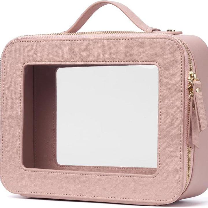 Astuccio da viaggio rosa con finestra trasparente, cerniera dorata e manico. Ideale per cosmetici. Design elegante e funzionale.