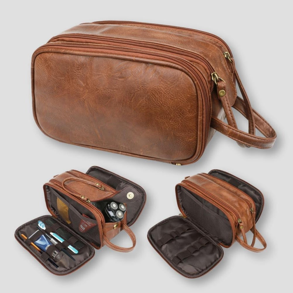 Borsello da viaggio in pelle marrone con cerniere multiple, scomparti interni per articoli da toeletta. Elegante e pratico per organizzare accessori.