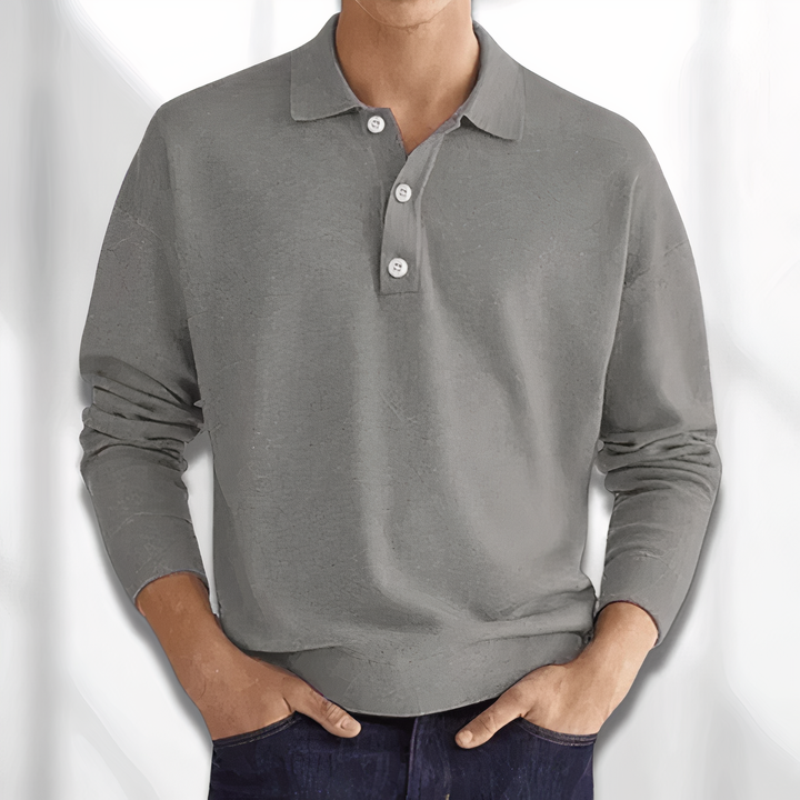 Maglione uomo grigio a maniche lunghe, colletto polo, bottoni bianchi, tessuto morbido, stile casual, perfetto per autunno e inverno.
