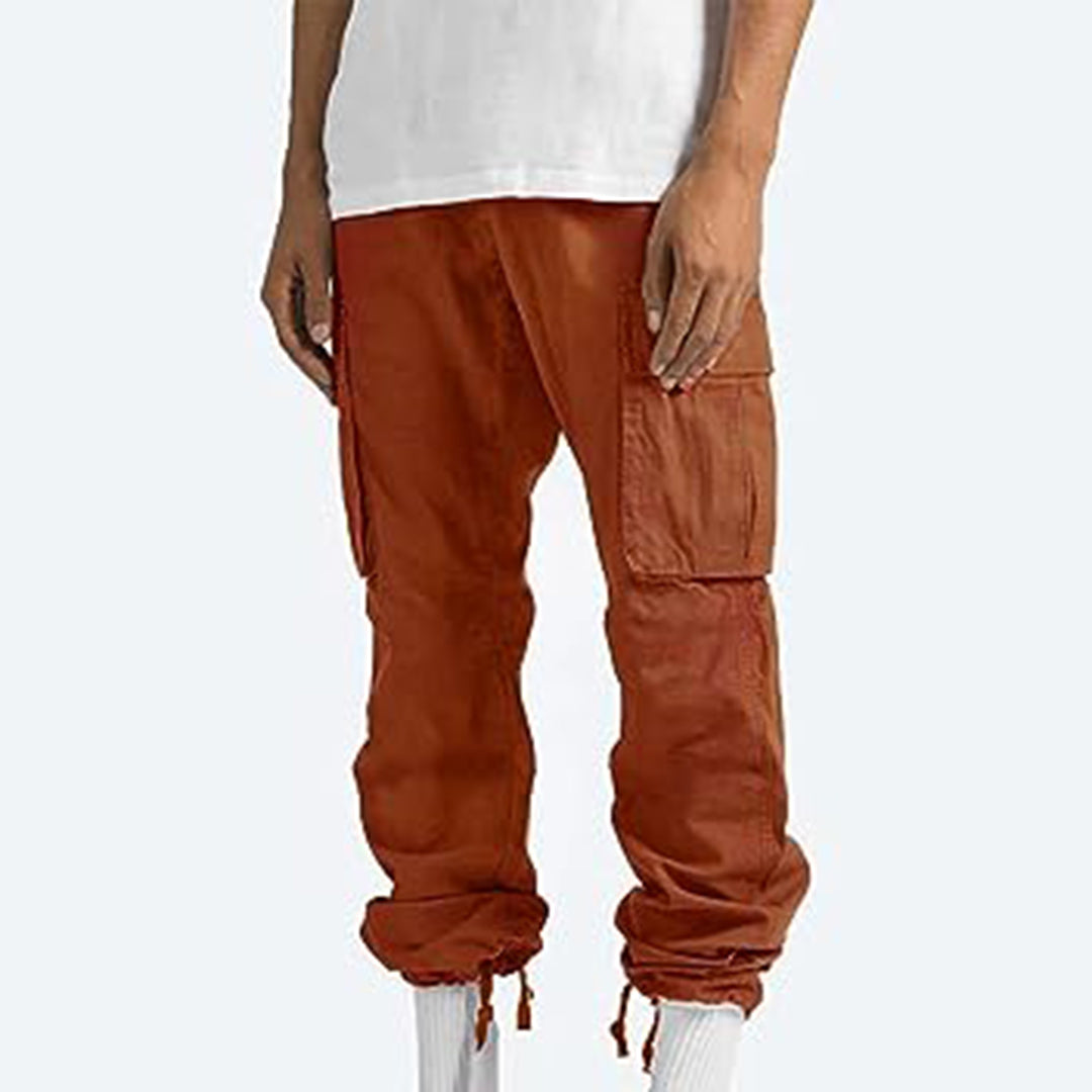 Pantaloni cargo uomo arancioni, tasche multiple, stile casual, cotone, elastico alla caviglia, moda streetwear, abbigliamento maschile trendy.