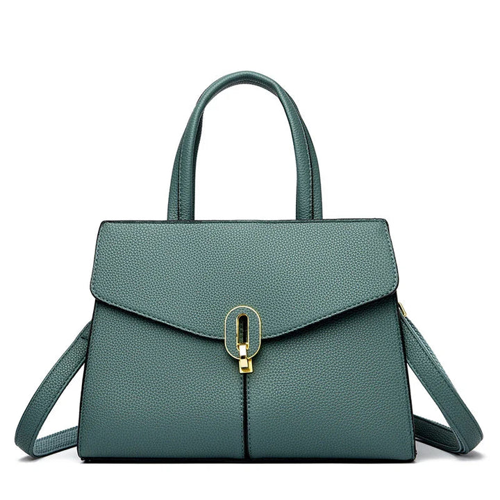 Borsa a mano in pelle verde con chiusura dorata, design elegante e moderno, ideale per moda femminile. Accessorio di tendenza per ogni occasione.