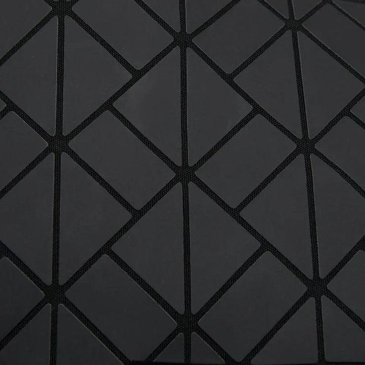 Tessuto nero con motivo geometrico a rombi, design moderno, texture elegante, ideale per arredamento e moda, alta qualità e resistenza.