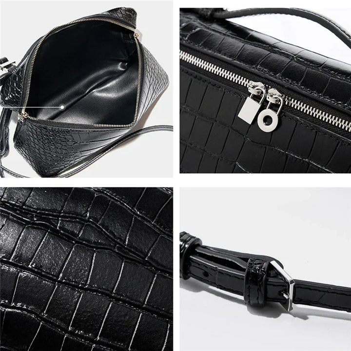 Borsa a tracolla nera in pelle effetto coccodrillo, con zip argentata e dettagli interni spaziosi. Cinturino regolabile. Elegante e versatile.
