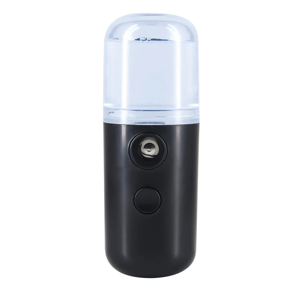 Nebulizzatore portatile nero, design compatto, serbatoio trasparente, ideale per idratazione viso e cura della pelle. Accessorio skincare innovativo.