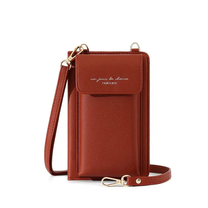 Custodia per cellulare in pelle marrone con tracolla regolabile, tasca frontale e chiusura a bottone. Accessorio moda elegante e funzionale.