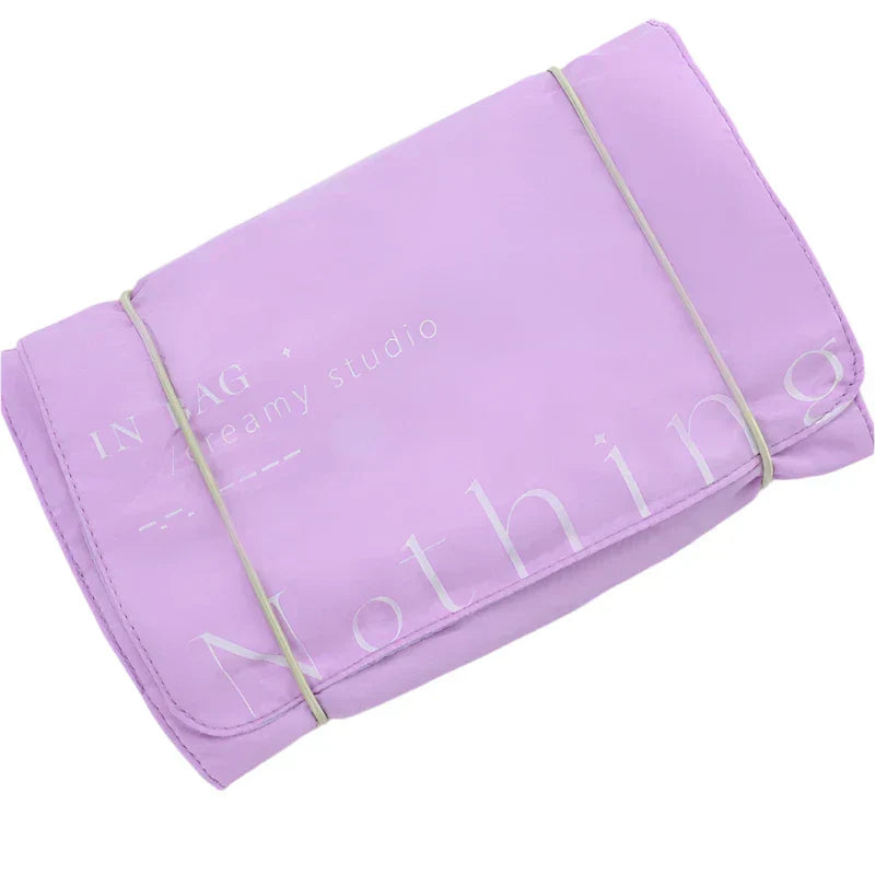 Borsa organizer da viaggio viola, pieghevole, con elastico. Ideale per cosmetici e accessori. Design compatto e pratico per valigia.