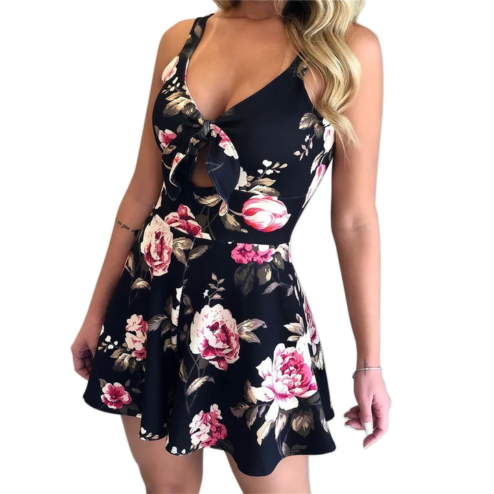 Abito estivo donna floreale nero, scollo a V, senza maniche, gonna svasata, motivo rose rosa e bianche, moda casual elegante.