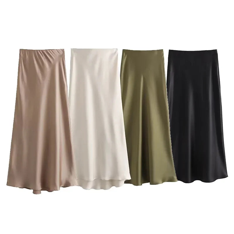 Quattro gonne lunghe in raso, colori beige, bianco, verde oliva e nero, eleganti e fluide, ideali per moda donna autunno inverno.