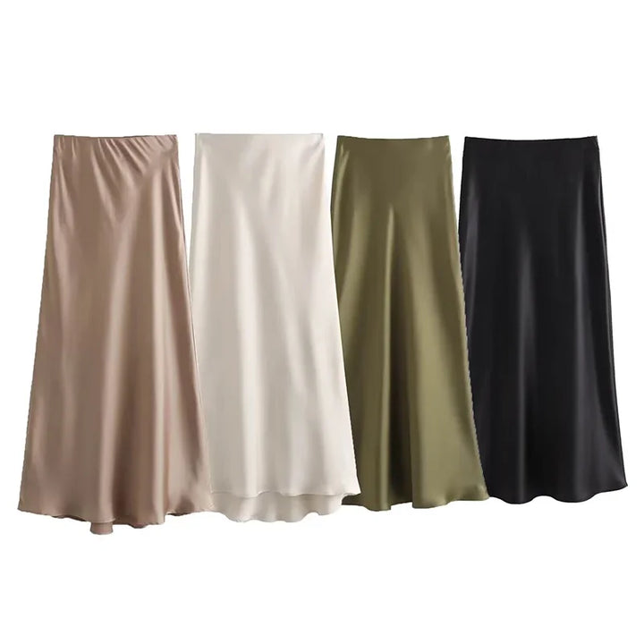 Quattro gonne lunghe in raso, colori beige, bianco, verde oliva e nero, eleganti e fluide, ideali per moda donna autunno inverno.