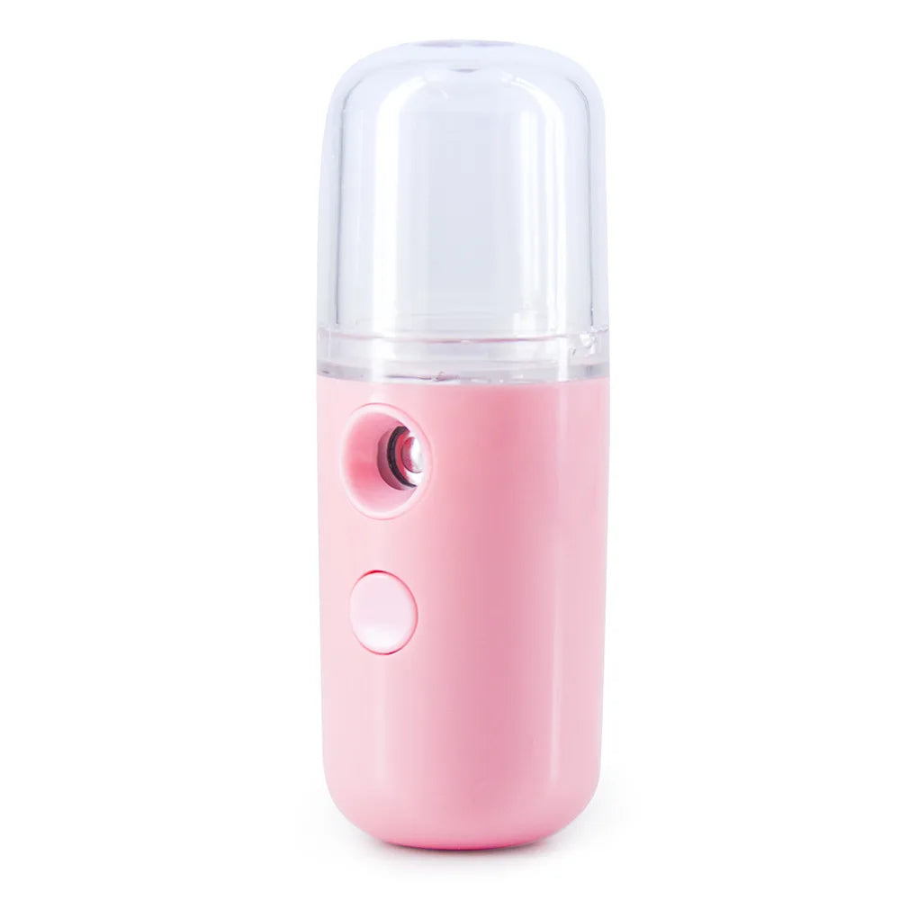 Umidificatore portatile rosa, design compatto, ideale per idratazione viso. Perfetto per viaggi, skincare, ricaricabile USB.