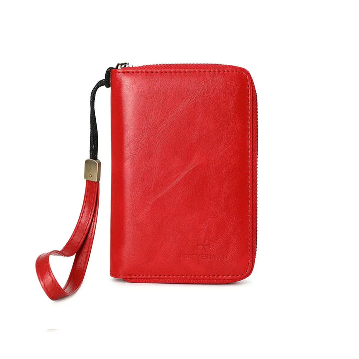 Portafoglio donna in pelle rossa con cerniera e cinturino da polso. Design elegante, ideale per moda e accessori femminili.