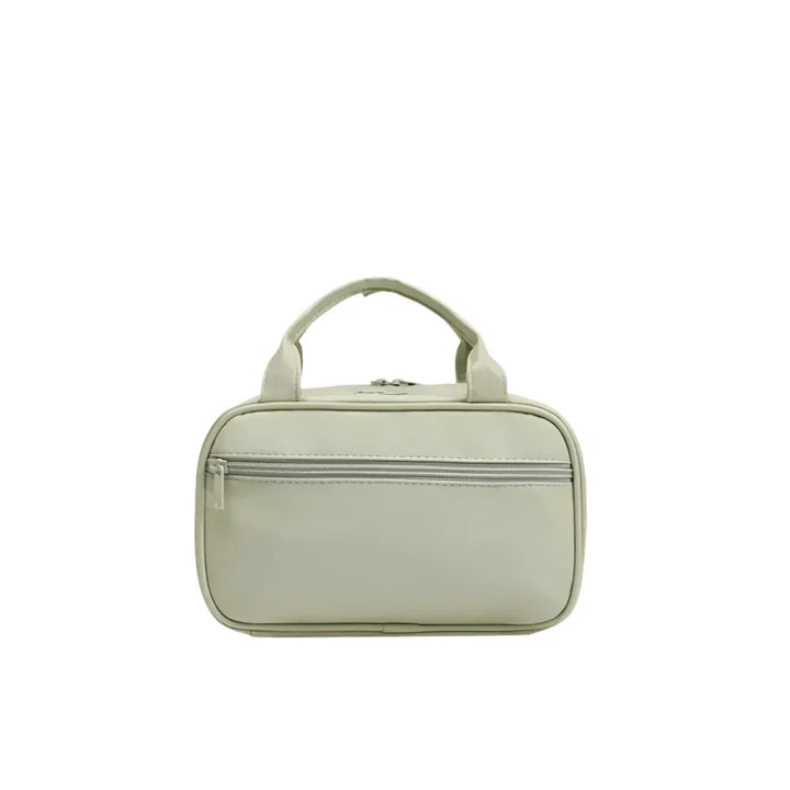Borsa da viaggio beige con manici, tasca frontale con cerniera. Design compatto, ideale per organizzare accessori. Elegante e funzionale.