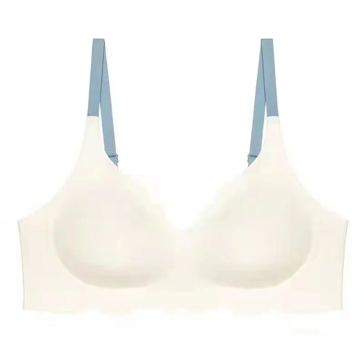 Reggiseno bianco senza cuciture con spalline blu, design confortevole e supporto leggero, ideale per uso quotidiano. Intimo donna elegante.